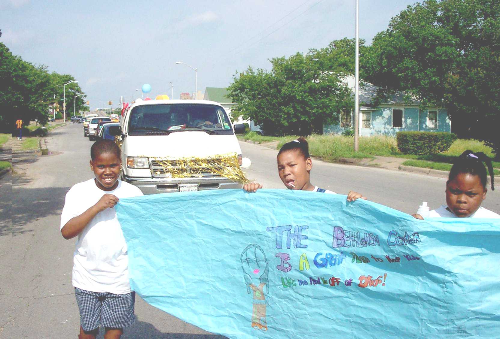 Youngsters Marching, With Home-made Banner